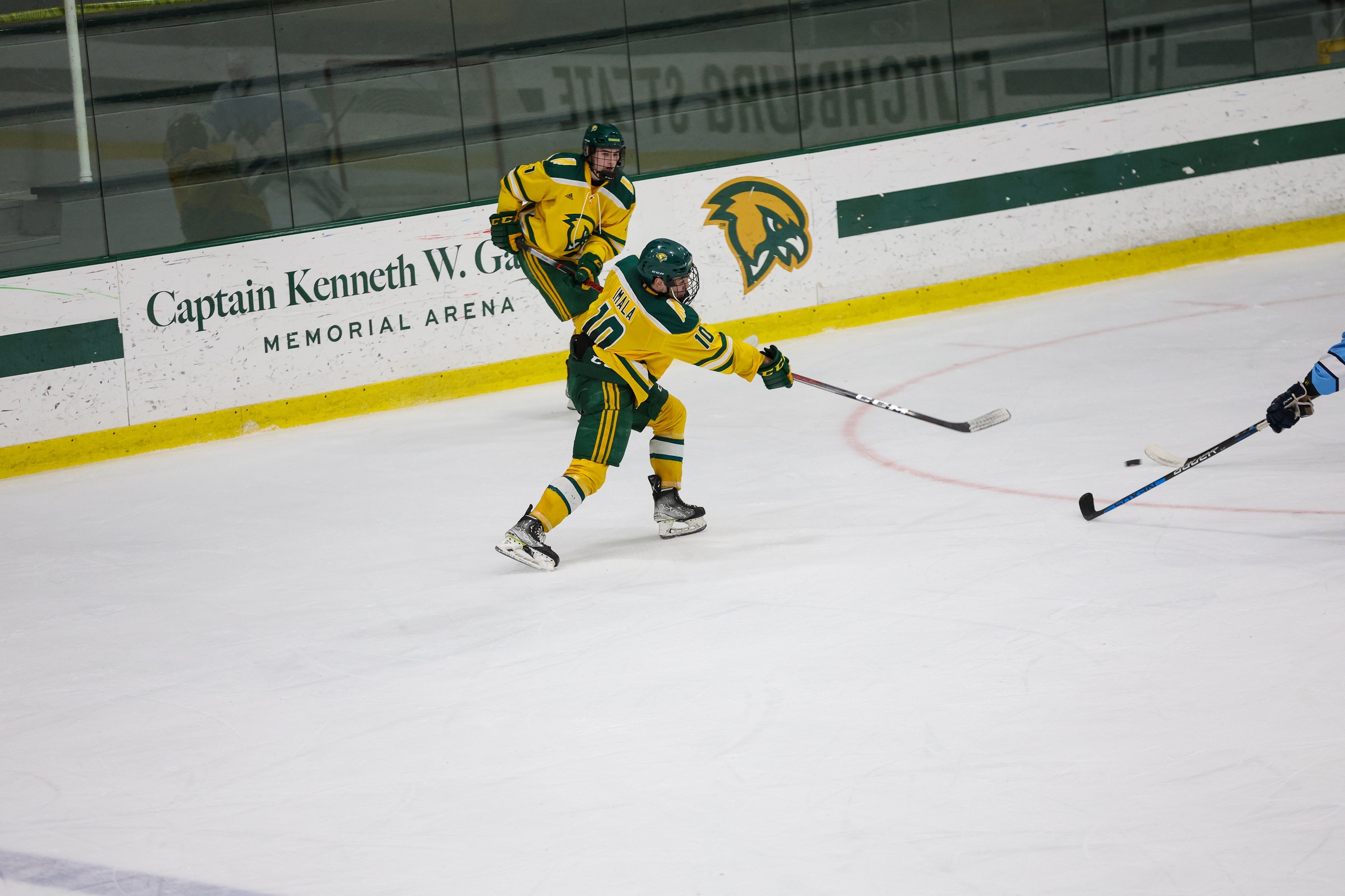 Ice Hockey Skates Past Lancers